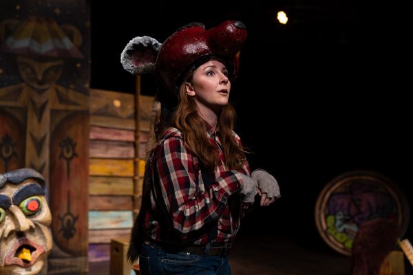 An actor dressed as a mouse