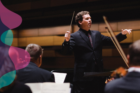 Maestro with wand in hand, conducting orchestra