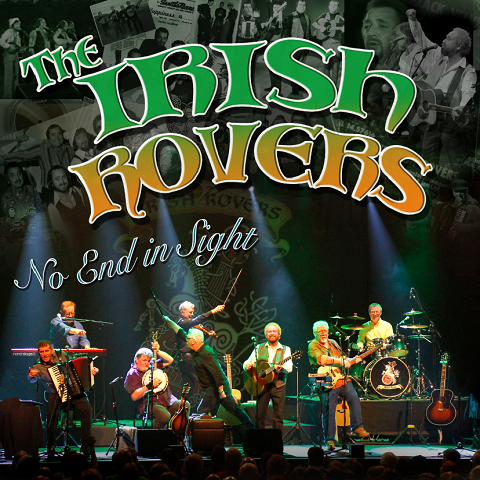 The Irish Rovers, seated on a stage with lights shining down