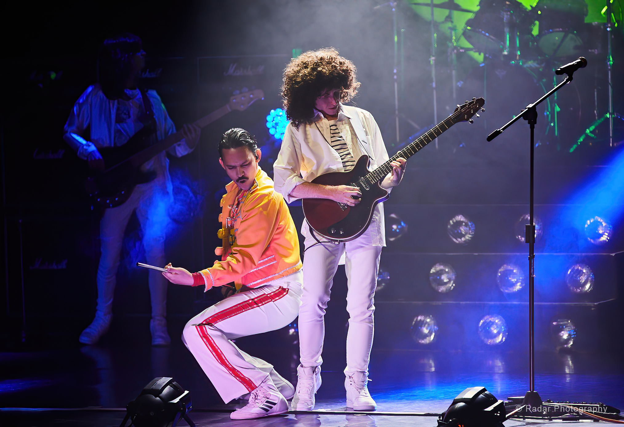 Queen: It's a Kinda Magic Queen performers on stage