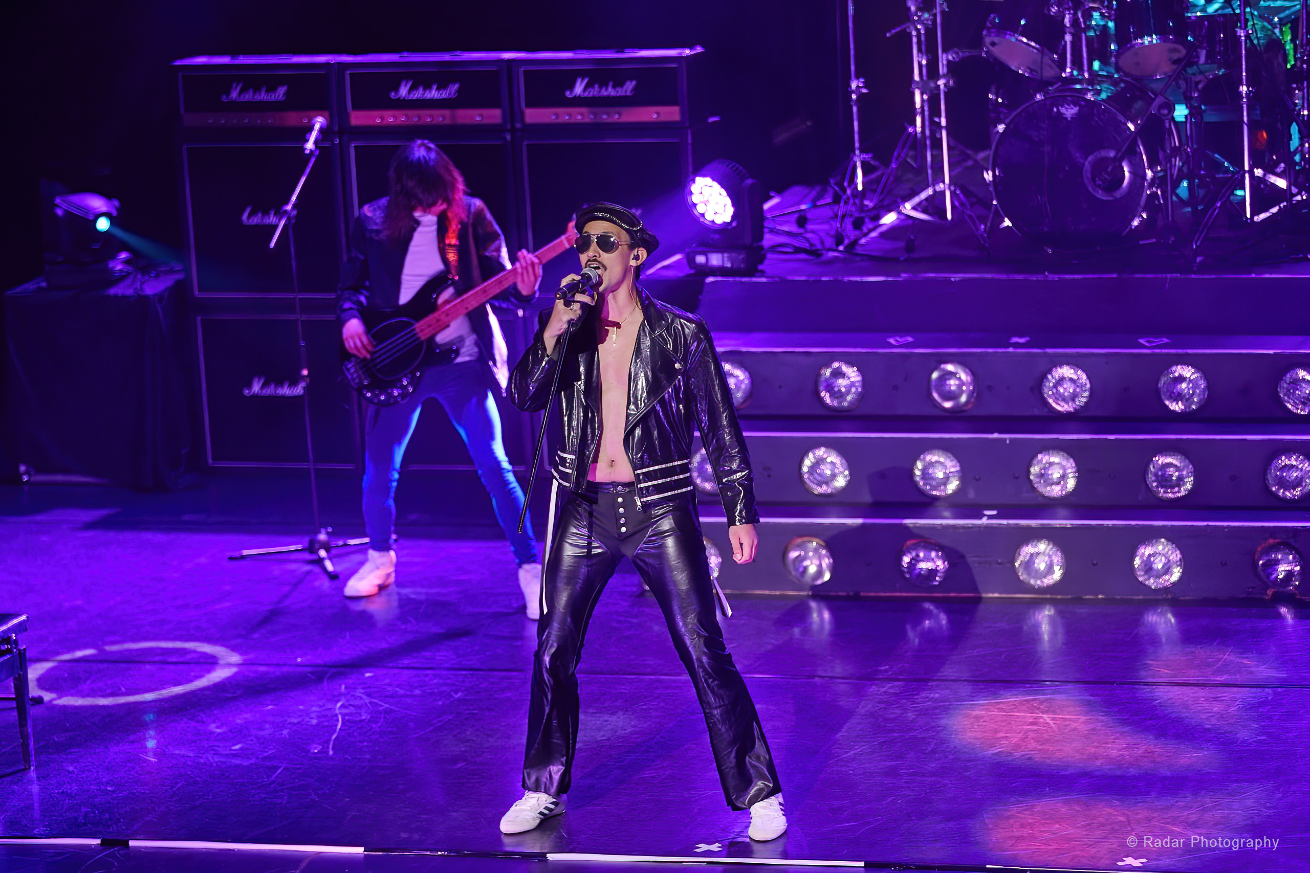 Queen: It's a Kinda Magic Queen performers on stage