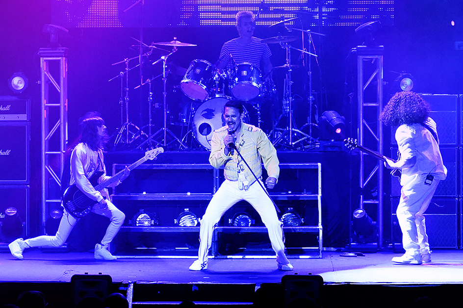 Queen: It's a Kinda Magic Group shot in blue tones