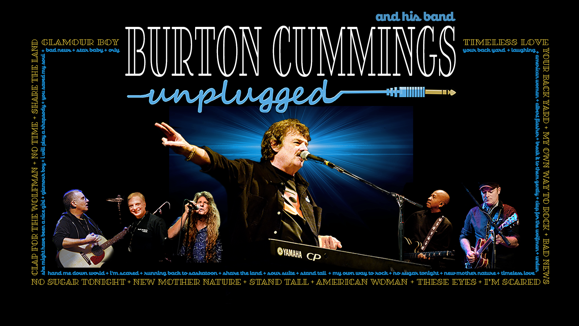 Burton Cummings on stage, singing into a microphone with his arm in the air