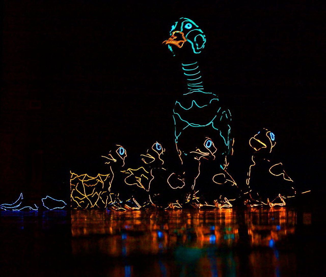 Glowing images of a mother duck and ducklings