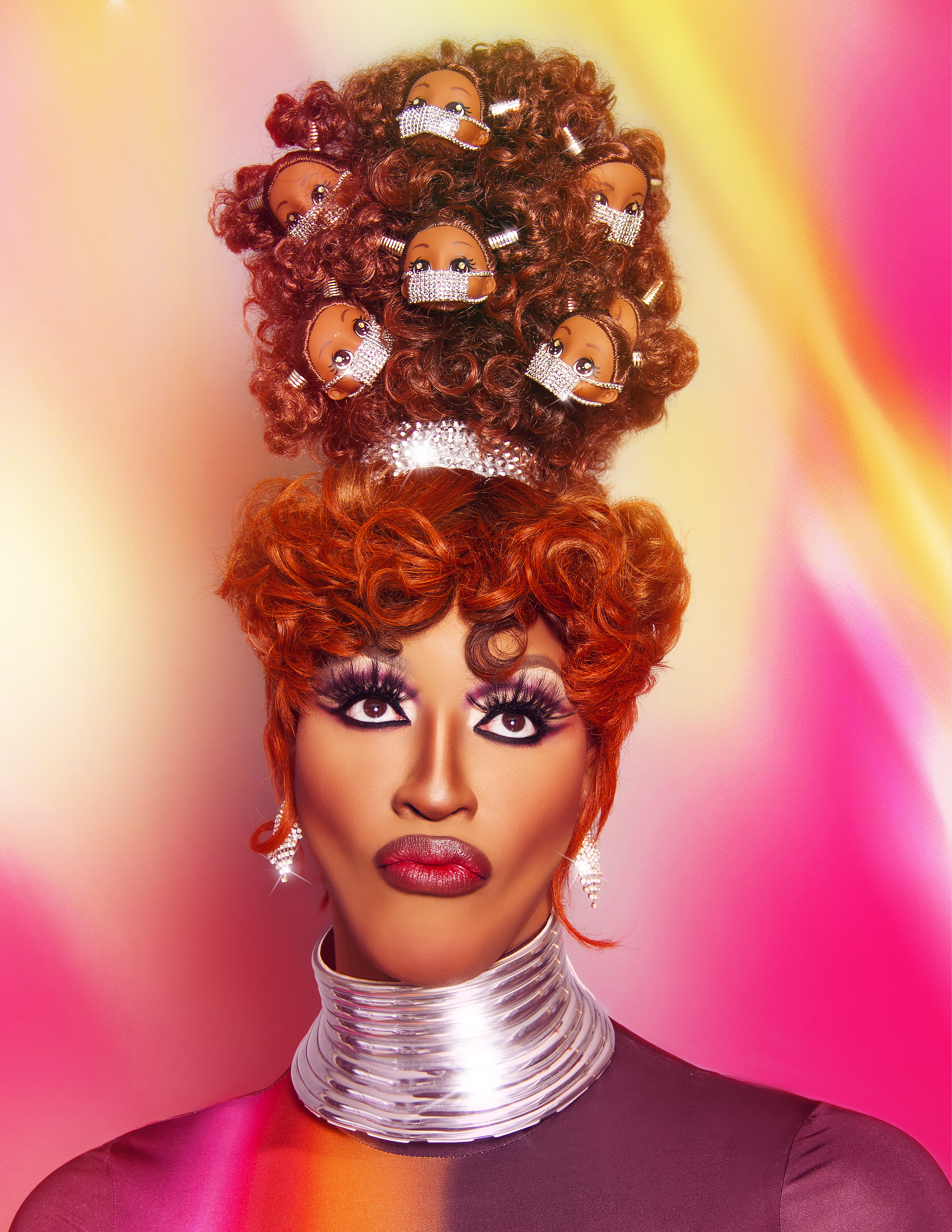 drag queen with a beehive hair style that includes doll heads with masks