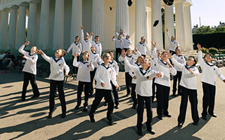 Vienna Boys throwing their hats in the air.