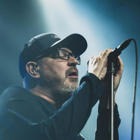 Matthew Good sings into a microphone