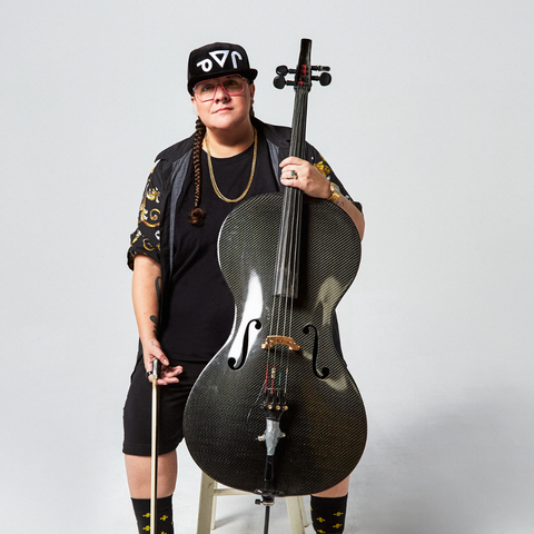 Cris Derksen sitting on a stool looking at the camera