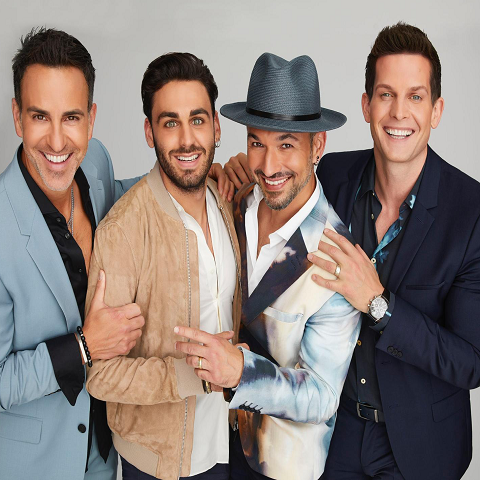 Four well dressed men who are members of The Tenors