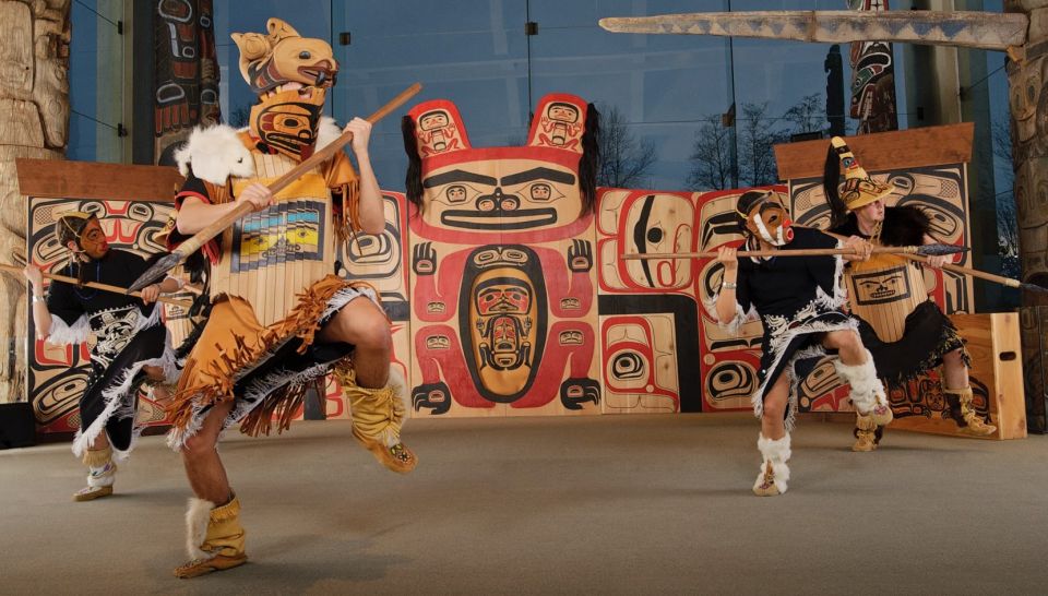 Theatrical performers wearing indigenous attire