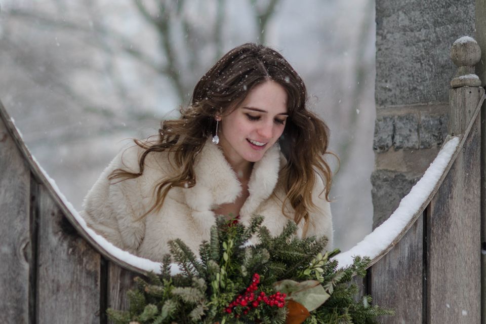3rd Annual A Michelle Kasaboski Christmas Michelle leans over fence in winter