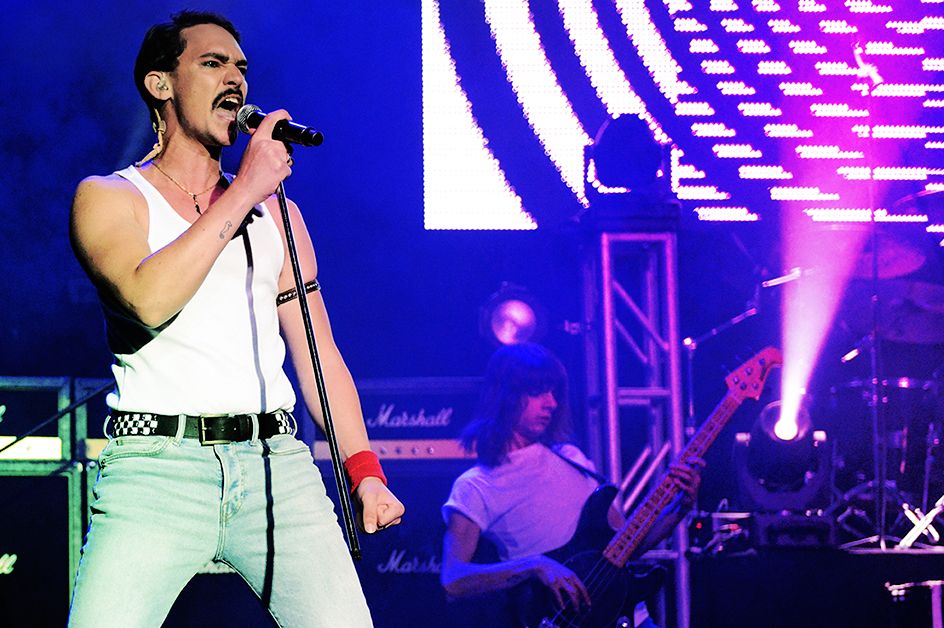 Queen: It's a Kinda Magic Show front man singing into microphone