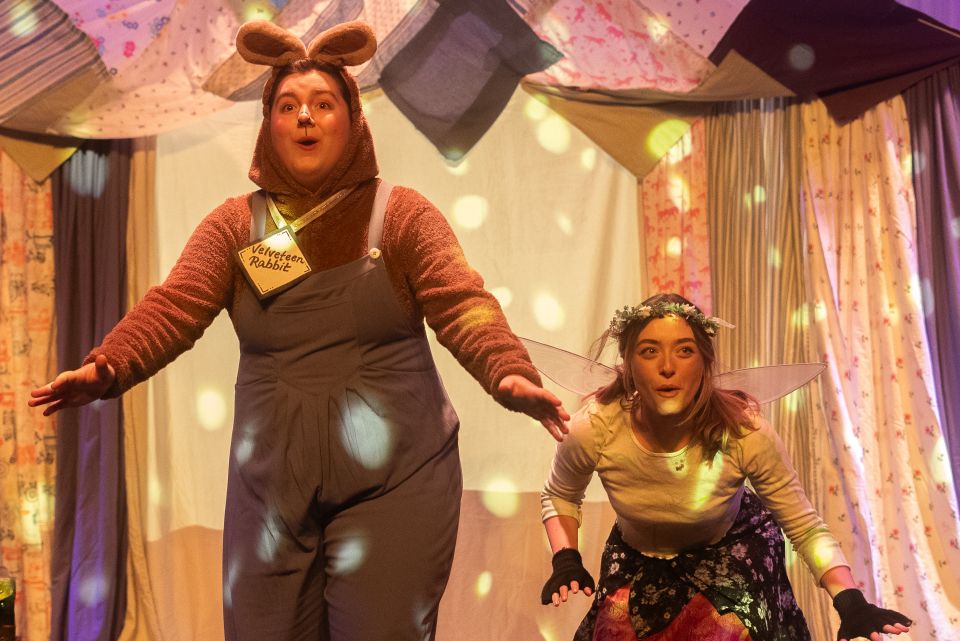 Two actors dresses in browns, one with bunny ears
