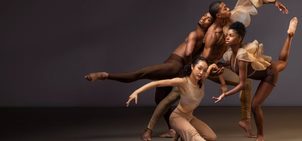 Athletic dancers performing onstage