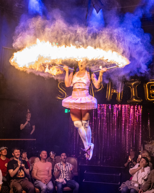 Performer with a ring of fire around her