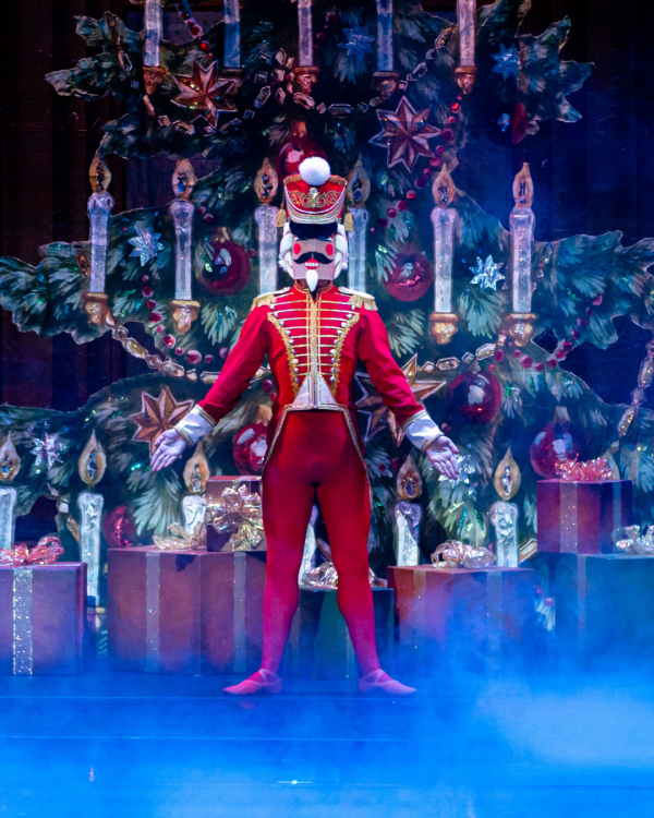 Nutcracker on stage dressed in Red