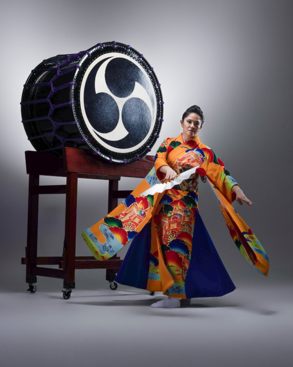Performer with large drum