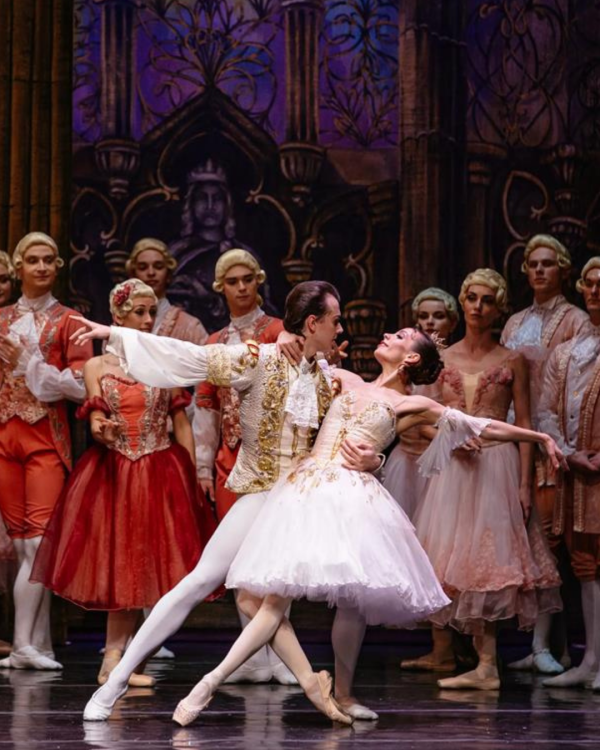 ballet dancers in reddish and white dress