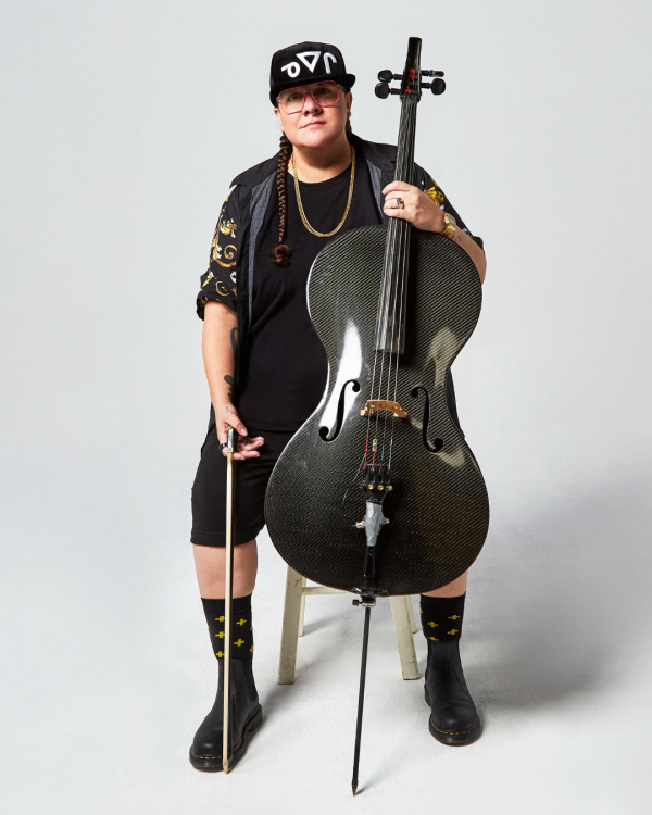 Cris Derksen sitting on a stool looking at the camera