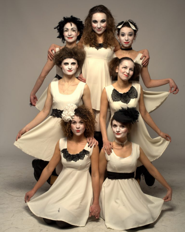 Dakh Daughters all in ivory dresses poised looking at the camera