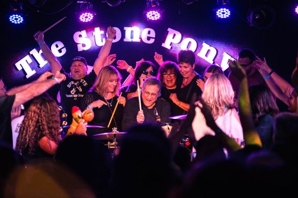 Max Weinber's band surrounded by fans. 