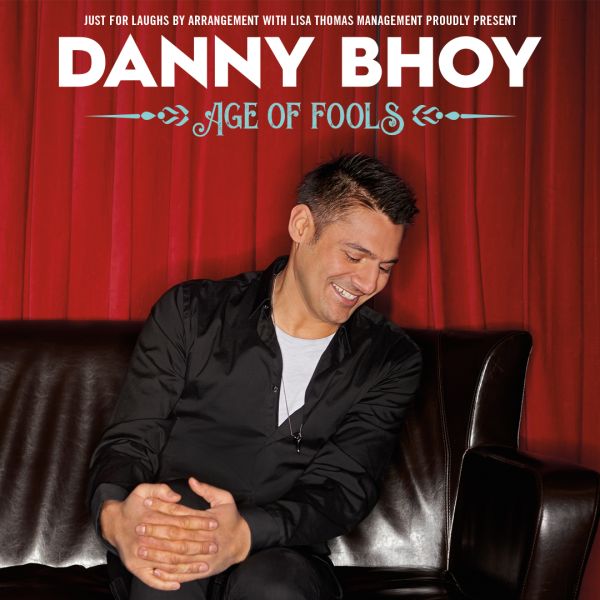 Danny Bhoy - Age of Fools Danny Bhoy sitting on a leather couch laughing