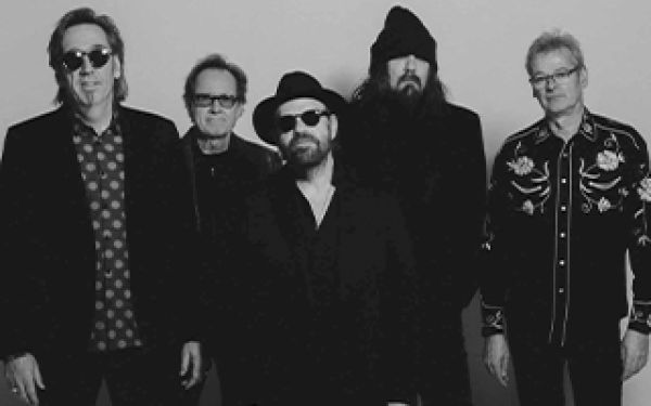 Members of the group lined up in a black and white photo