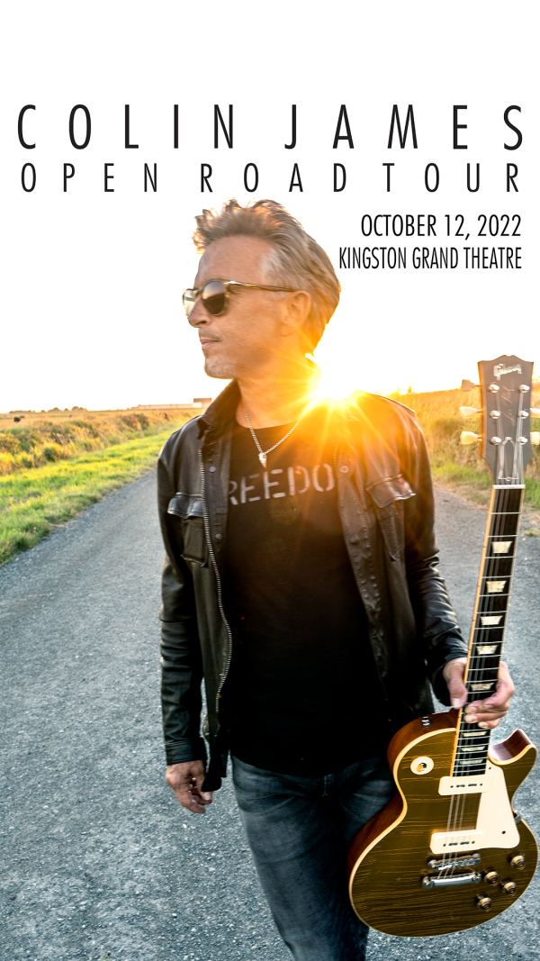 Colin James - Open Road Tour Colin James in black leather jacket and sunglasses with his guitar on a road with the sun shining over his shoulder