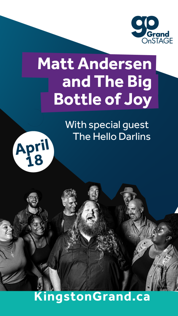 Matt Andersen, a white, long haired gentleman, singing with his head thrown back and his accompanying group surrounding him.