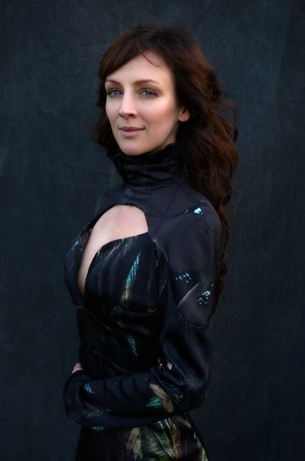 Sarah Slean, a brunette with all black clothing