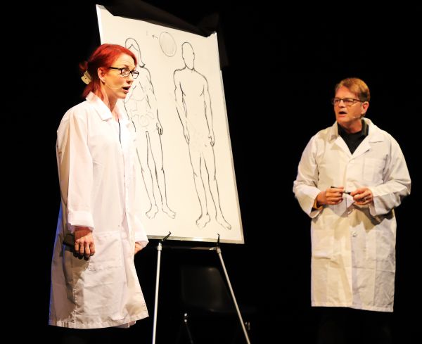 actors with a flip chart