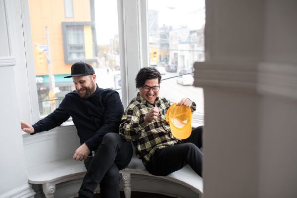 Choir! Choir! Choir! - Photo: Lindsay Duncan members of CCC, seated together in a window sill, laughing out loud