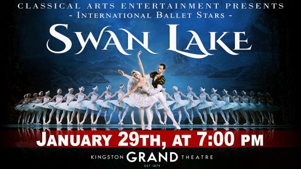 a row of ballet dancers with a pair of dancers up front and center in white