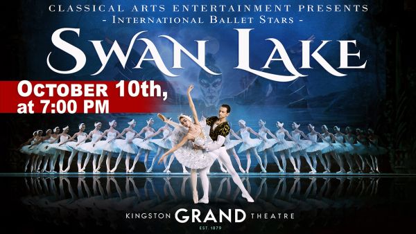a row of ballet dancers with a pair of dancers up front and center in white