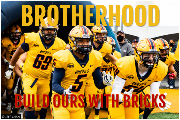 Football players in yellow Queen’s uniforms run out together from a tunnel, with bold text reading “BROTHERHOOD” above them and “BUILD OURS WITH BRICKS” below