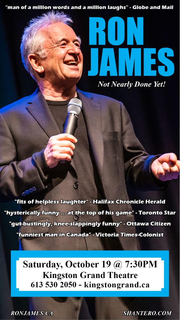 middle aged comedien on stage wtih a microphone