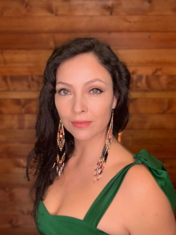 Headshot of Santee Smith in a green dress