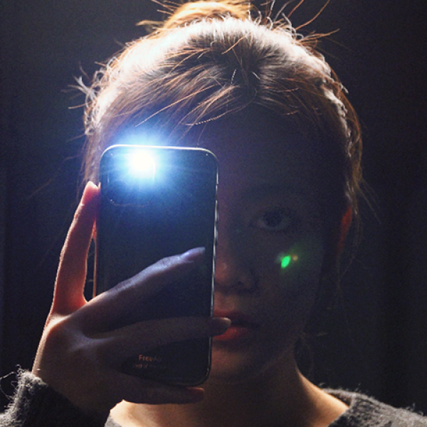 someone taking a selfie in the mirror