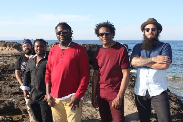 The band stood in front of a body of water