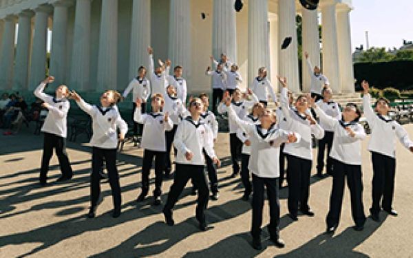 Vienna Boys throwing their hats in the air.