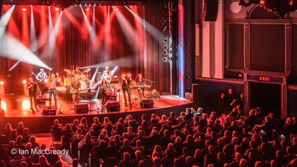 full house watching group perform