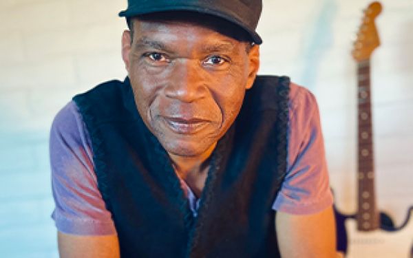 close up of Robert Cray leaning in to the camera